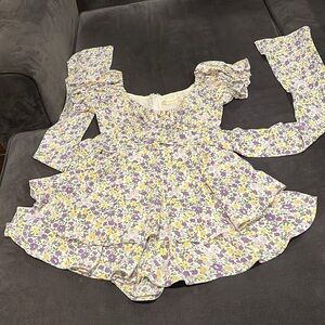 Altar’d State Purple Flowers Dress with built in shorts. Lined. Tie goes to back